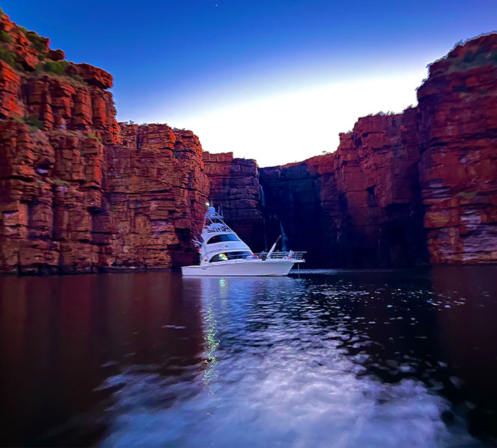 Kaizen Sport Fishing Charters boat cruising at sunset