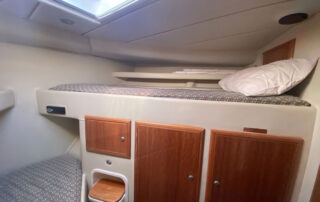 Kaizen Sport Fishing Charter Boat - Bedroom with comfortable bunk beds and plenty of storage