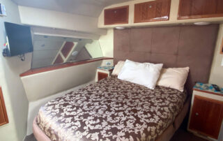 Kaizen Sport Fishing Charter Boat - Bedroom with comfortable Double Bed and flat screen tv
